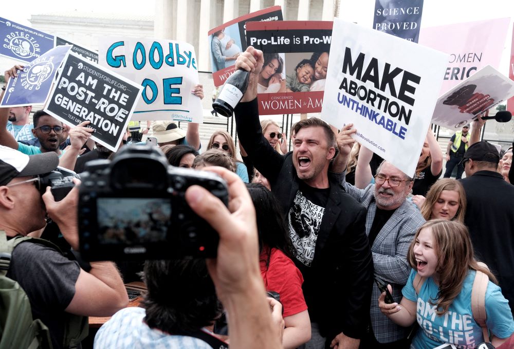 Pro-life demonstrators celebrate outside the U.S. Supreme Court in Washington June 24, 2022, as the court ruled in the Dobbs case, overturning the landmark Roe v. Wade decision. Pro-life demonstrators celebrate outside the U.S. Supreme Court in Washington June 24, 2022, as the court ruled in the Dobbs case, overturning the landmark Roe v. Wade decision.